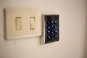a remote control is hooked up to a lightswitch at Rio Marina central apartment- 200m dal mare in Rio Marina