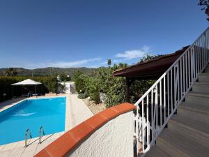a swimming pool on the side of a house at Casa Relax in Gaggi