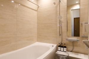 a bathroom with a tub and a toilet and a sink at 青梅駅3分OME桜梅庵omean tinyhouse designers hideaway in Ome +56 photos
