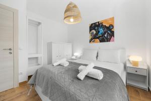 a bedroom with a bed with white towels on it at Villa LanaB - Private Pool - by Istrabook in VeliGolji +48 photos