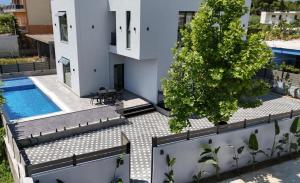an aerial view of a house with a swimming pool at Grand Avelor Hotel in Vlorë