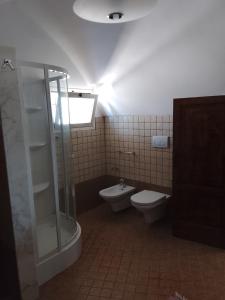 a bathroom with a shower and a toilet at Villa rinalda Francavilla in Francavilla Fontana