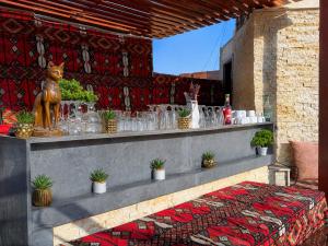 a display of glasses and plants on a ledge at Marquis Pyramids Hotel in Cairo