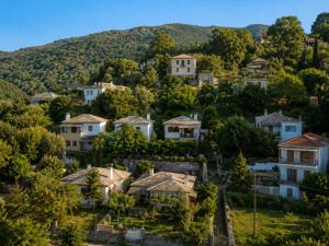 a small town in the mountains with houses at Deja Blue in Mouresi