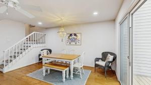 a dining room with a table and chairs at Salt Pond --- 38435 Mainsail Dr #9 in Bethany Beach