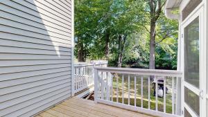a porch of a house with a white railing at Salt Pond --- 38435 Mainsail Dr #9 in Bethany Beach +46 photos