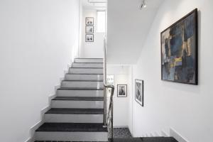 a staircase in a building with a painting on the wall at FabHotel Infinity Residency in Pune