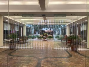 a lobby with a table and chairs in a building at Casa Américas in Mexico City +161 photos