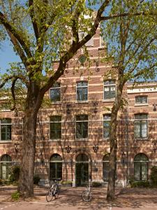 two bikes parked in front of a brick building at YAYS Amsterdam Maritime by Numa in Amsterdam +37 photos