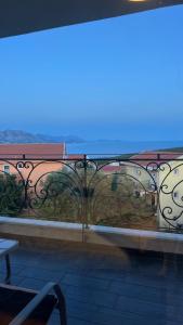a view of a balcony with a train on it at Apartment Sunrise in Kunjići +9 photos