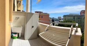 a balcony with a toilet on the side of a building at ZENIT Rooms in Senigallia