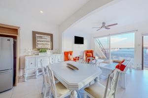 a kitchen and dining room with a table and chairs at Dog-Friendly Villa with Heated Outdoor Pool, Hot Tub, Streaming, Balcony, Grill in Rosarito