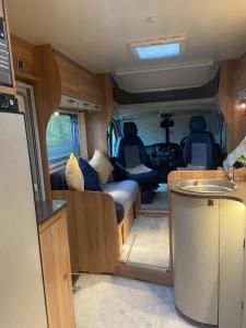 an interior view of an rv with the back door open at Cefn Farm - Hyssington Heights in Hyssington +27 photos