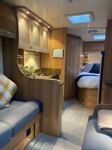 a small room with a bedroom and a bed at Cefn Farm - Hyssington Heights in Hyssington