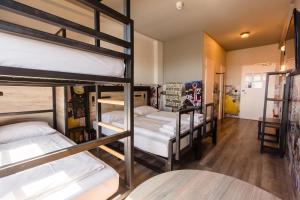 a group of bunk beds in a room at a&o Hamburg City in Hamburg +39 photos