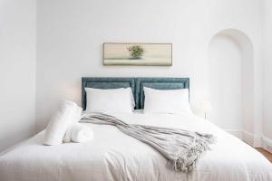 a bedroom with a large white bed with white pillows at Scott Suite - Donnini Apartments in Kilmarnock +27 photos