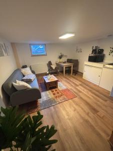 a living room with a couch and a table at Small 45 M² Apartment in Bad Kreuznach