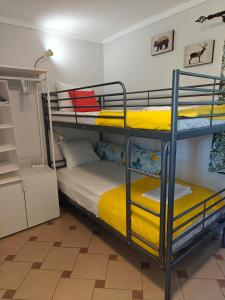 a bedroom with two bunk beds in a room at Beach house IvMare in Ierissos