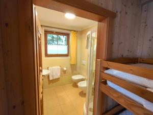 a bathroom with a toilet and a sink at Hotel Chalet val di Rabbi in Rabbi +69 photos
