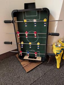 a ping pong rack in a room next to a toilet at Travel Light in Tainan