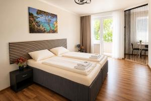 a bedroom with a large bed in a room at Apartment Hotel in Nuremberg