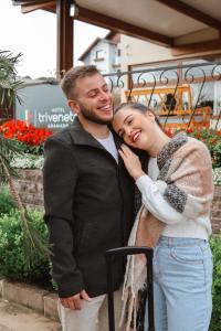 a man and a woman posing for a picture at Hotel Triveneto Gramado in Gramado +50 photos