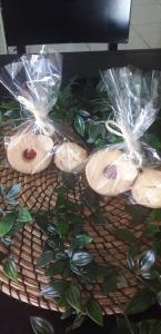 four bagels on a table with a plant at Residencial Beleza in Mindelo