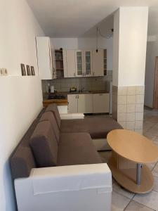 a living room with a couch and a table at Soča Kayaker in Čezsoča