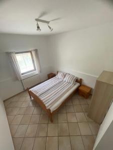 a bedroom with a bed and a window at Soča Kayaker in Čezsoča