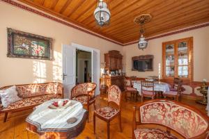 a living room with a table and chairs at Leda Hamam House in Plomari