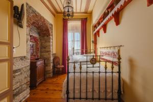 a bedroom with a bed in a room at Leda Hamam House in Plomari