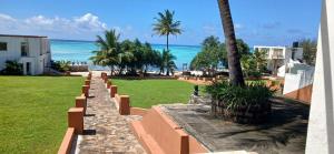 a view of the beach from the balcony of a resort at Game Fish Lodge in Nungwi