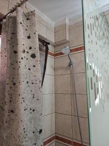 a rock wall in a bathroom with a shower at Beach house IvMare in Ierissos +44 photos