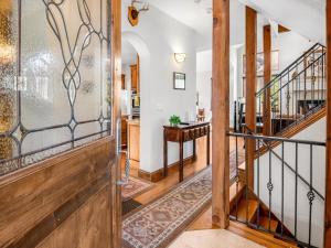 a hallway with a stairway leading to a living room at Alpine Drive Chalet in Vail