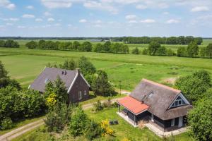 an aerial view of a house and a barn at Buitengoed Rheelanden in Ansen
