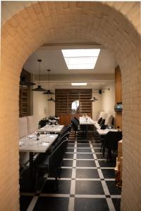 an archway in a restaurant with tables and chairs at Hotel San Valentino in Rome