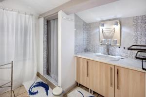 a bathroom with a sink and a shower at Le Mas de la Rode in Saumane +23 photos