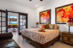 a bedroom with a bed and a couch at Airy, Beach-View Dog-Friendly Villa with Patio, Outdoor Pool, Streaming, AC in Rosarito +41 photos