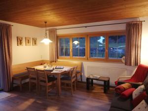a living room with a table and a couch at Bungalow Müller in Brand
