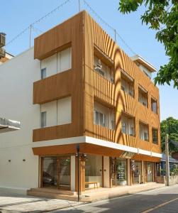 a building on a street in front of a building at Acoz in Ban Zong Katiam