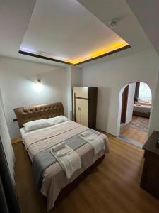 a bedroom with a large bed in a room at Nora Palace Hotel in Develi