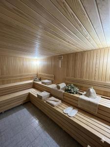 a sauna with two beds and towels in it at Nora Palace Hotel in Develi