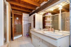 a bathroom with two sinks and a large mirror at Le Séchoir D'Alice in Saint-Germain-du-Salembre +27 photos