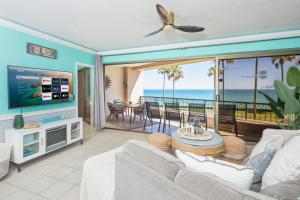 a living room with a view of the ocean at Sonoran Spa Amazing Oceanfront E206 in Puerto Peñasco