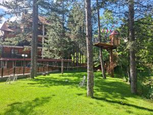 a tree house in the middle of a park at Apartmani Sredojevic in Kaludjerske Bare