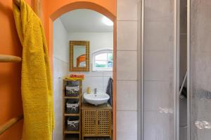 a bathroom with a sink and a mirror at Ferienhaus Reiseoase in Bützow +33 photos