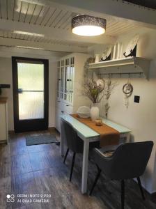 a dining room with a table and chairs at House Silvana in Postira