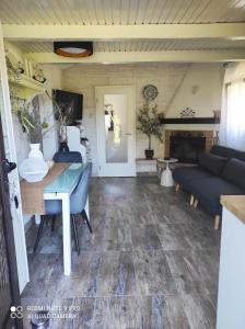 a living room with a table and a couch at House Silvana in Postira