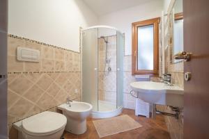 a bathroom with a toilet a sink and a shower at Breathtaking Sea Views & Jacuzzi in Cefalù in Cefalù +81 photos