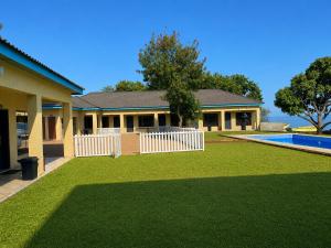 a house with a yard with a swimming pool at Summerland Lodge in Chembe